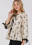 Tie front bow print peplum top in cream and black