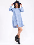 Long sleeve tiered chambray tunic top with long sleeves and a tiered loose fit ￼