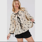 Tie front bow print peplum top in cream and black