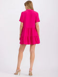 Short sleeve button up tiered tunic top in fuchsia