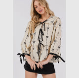 Tie front bow print peplum top in cream and black