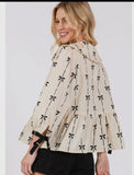 Tie front bow print peplum top in cream and black